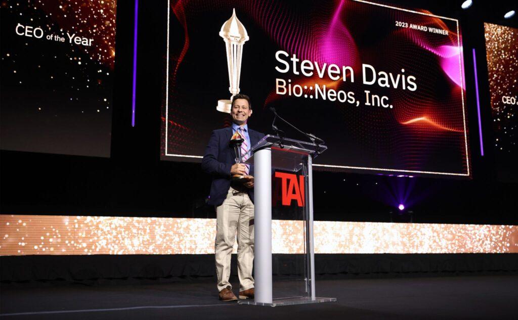 Steve Davis on stage smiling at the Prometheus Awards accepting the 2023 CEO of the Year award. 